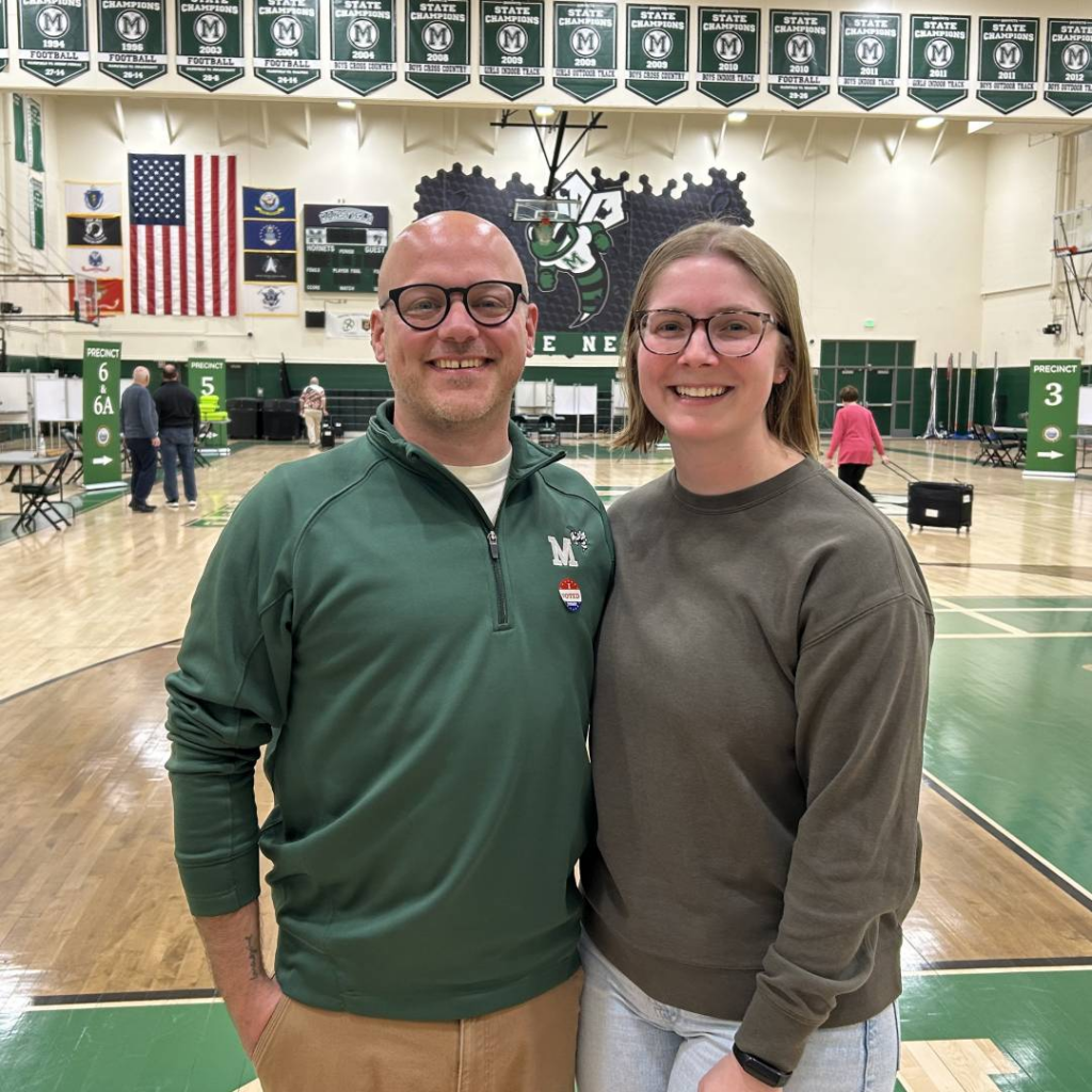 Mark Corsillo stands in the Mansfield High School Gym with his wife after being sworn in as the newest member of the Mansfield Select Board on May 12, 2026.